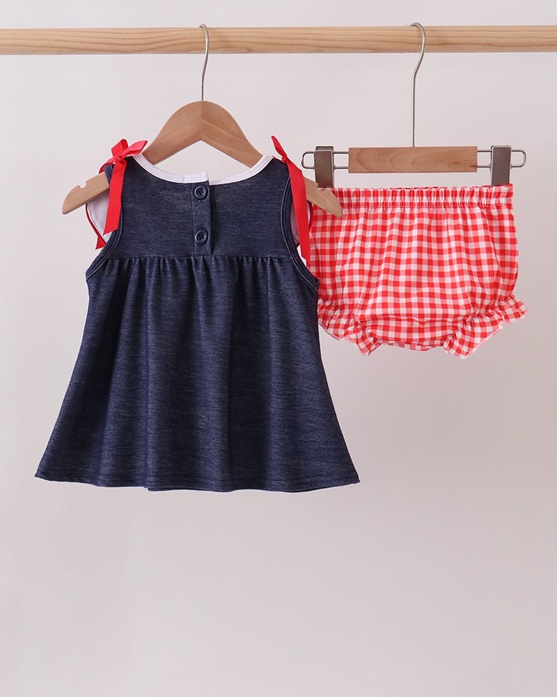 Navy denim sleeveless dress with red gingham apple appliques, ribbon bows, plus bloomers