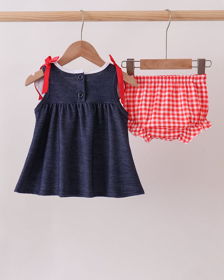 Navy denim sleeveless dress with red gingham apple appliques, ribbon bows, plus bloomers