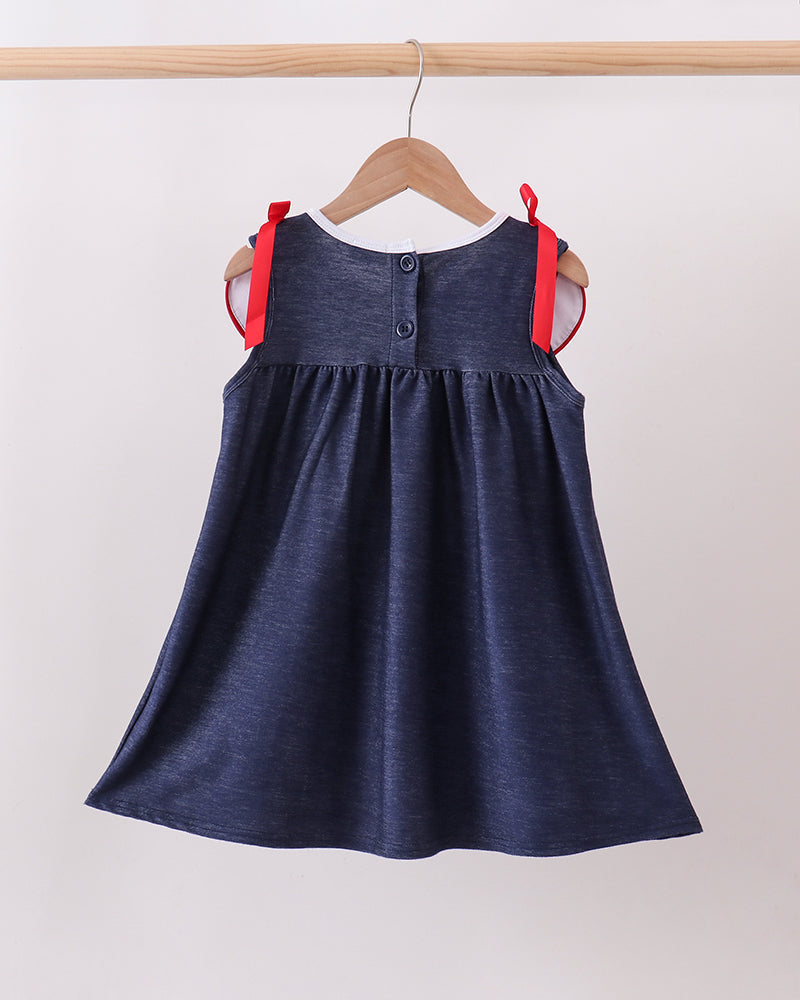 Navy denim dress with gathered skirt and red shoulder bows