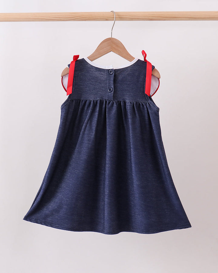 Navy denim dress with gathered skirt and red shoulder bows