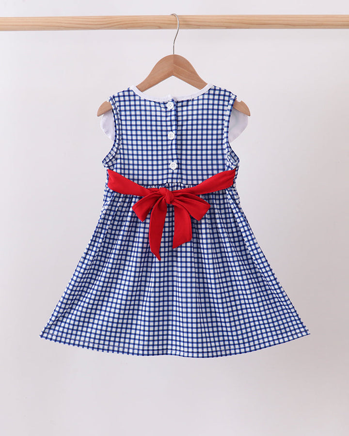 Navy Apple Embroidered Gingham Dress on wooden hanger