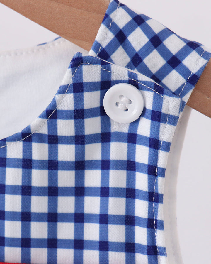 Blue gingham romper with white button