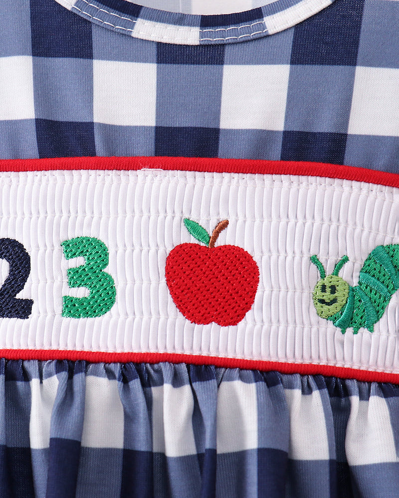 Navy gingham dress bodice with smocked band and 123 apple applique detail