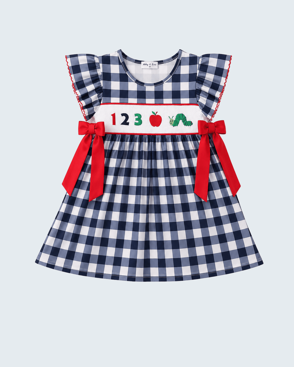 Navy gingham smocked dress with apple print and red bow ties