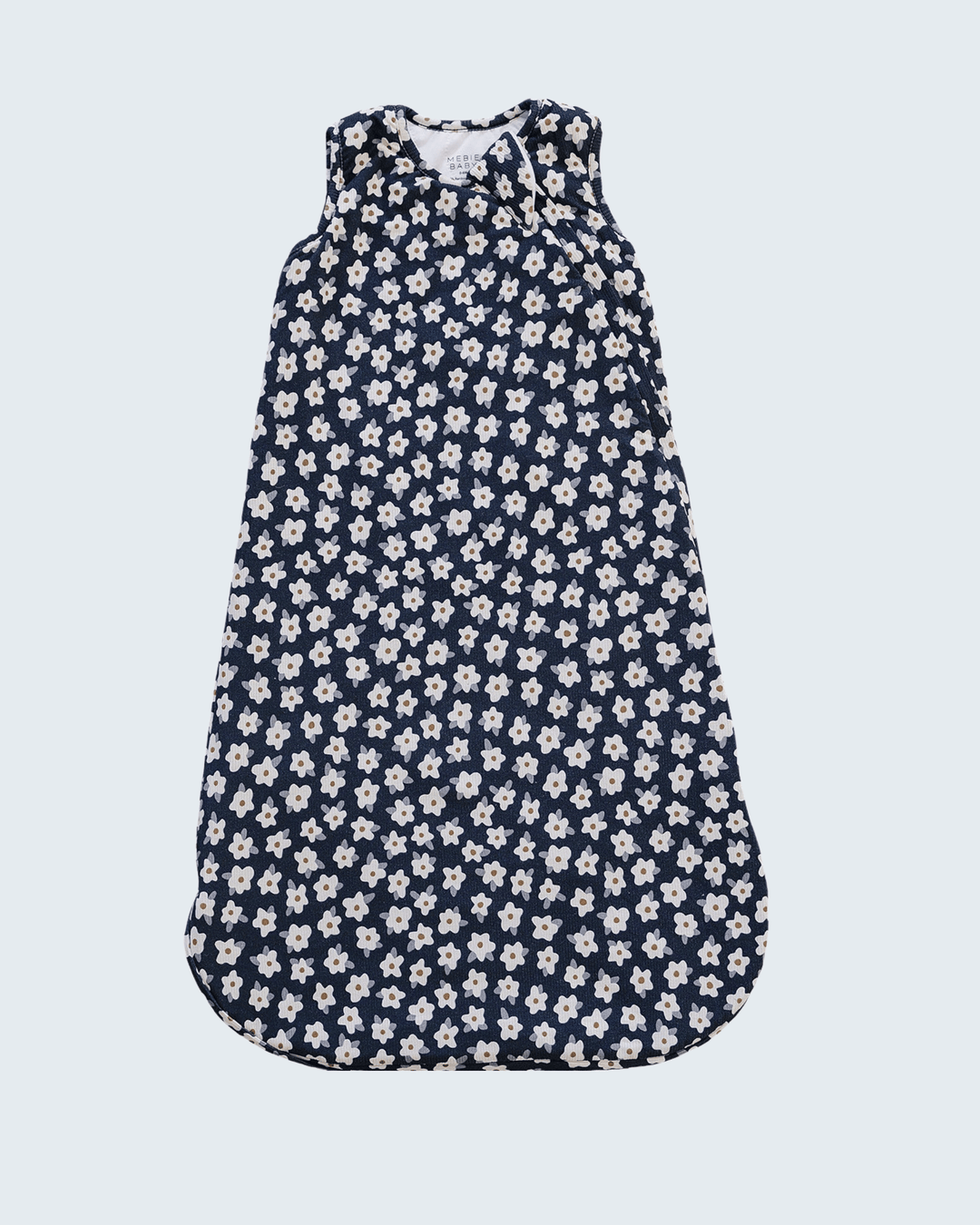 A sleeveless baby sleep sack with a dark navy blue background and an all-over white floral pattern, shown flat against a light gray background.