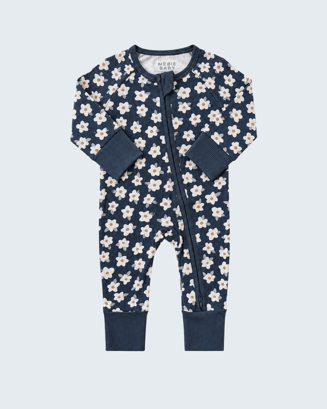 Navy ribbed bamboo romper with white daisy print, long sleeves, front zipper