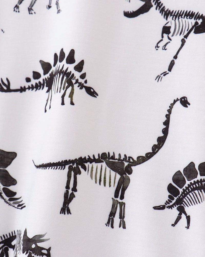 Pattern of black dinosaur skeletons on a white background