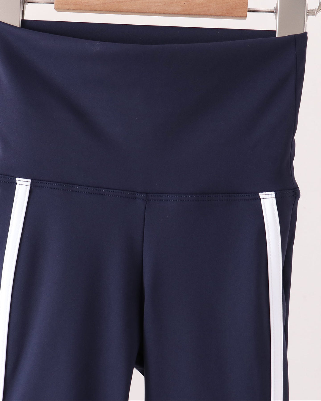 Navy active flare pants with white double side stripes and waistband