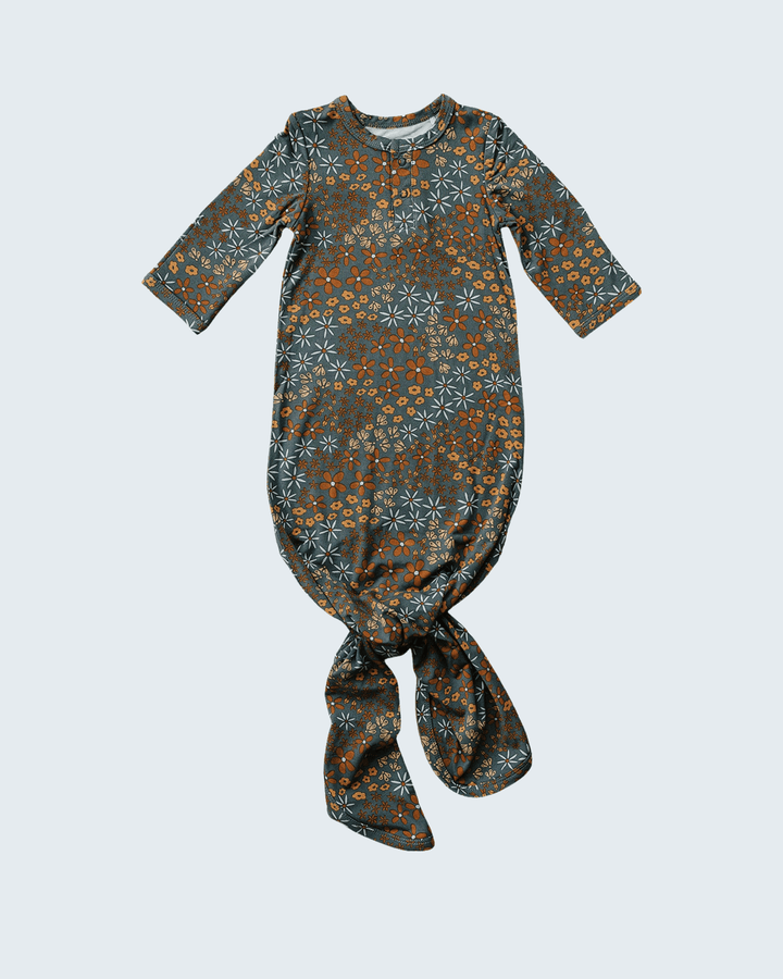 Floral patterned baby wrap on a light gray background