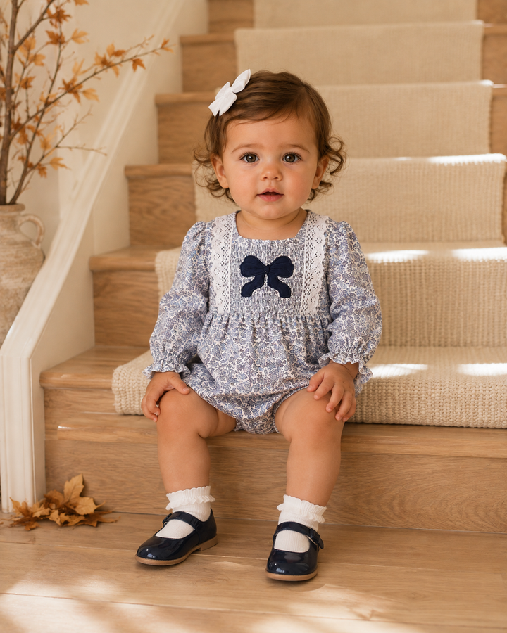 Baby girl sitting on a stair step