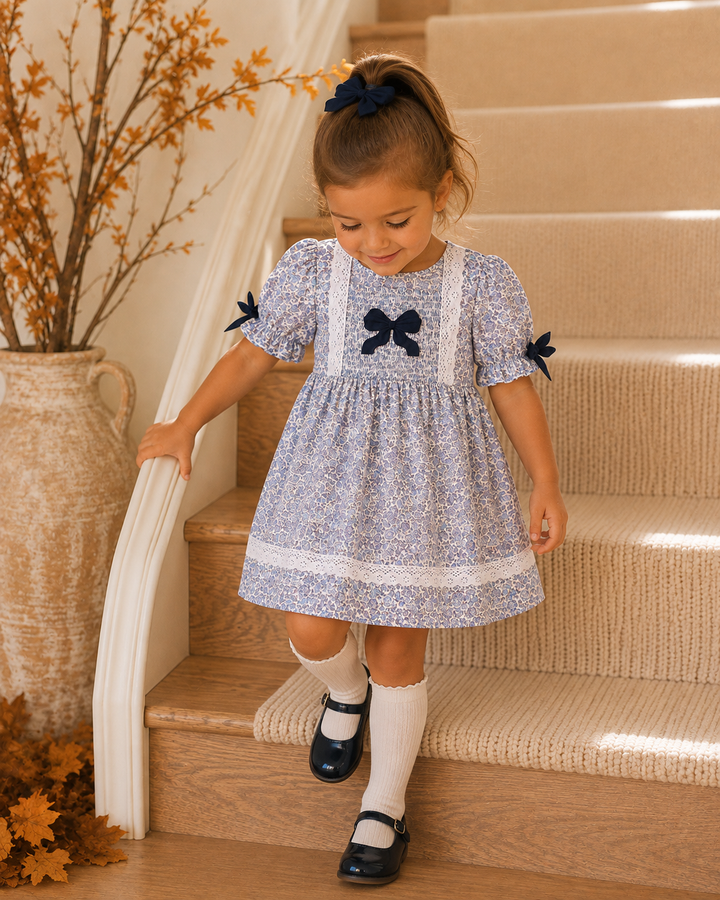 Young girl walking down a set of stairs.