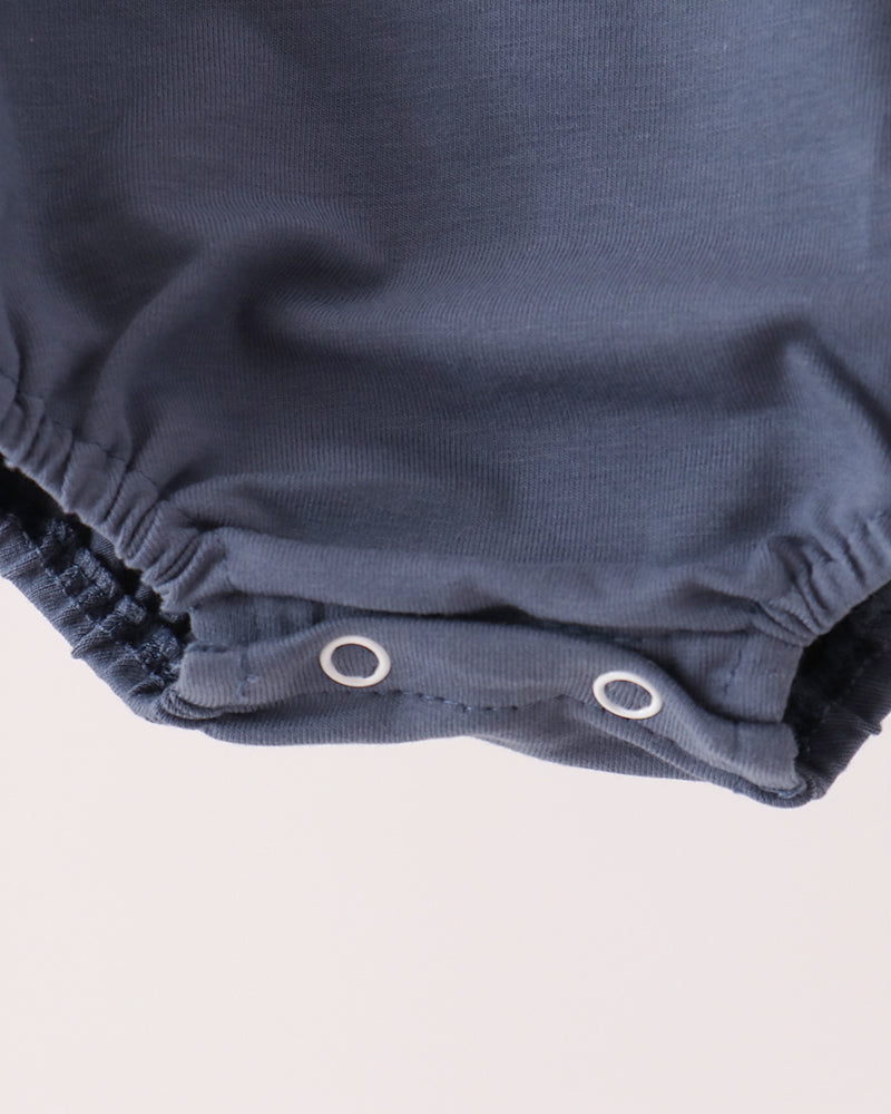 Navy baby romper with snap button closure at leg opening