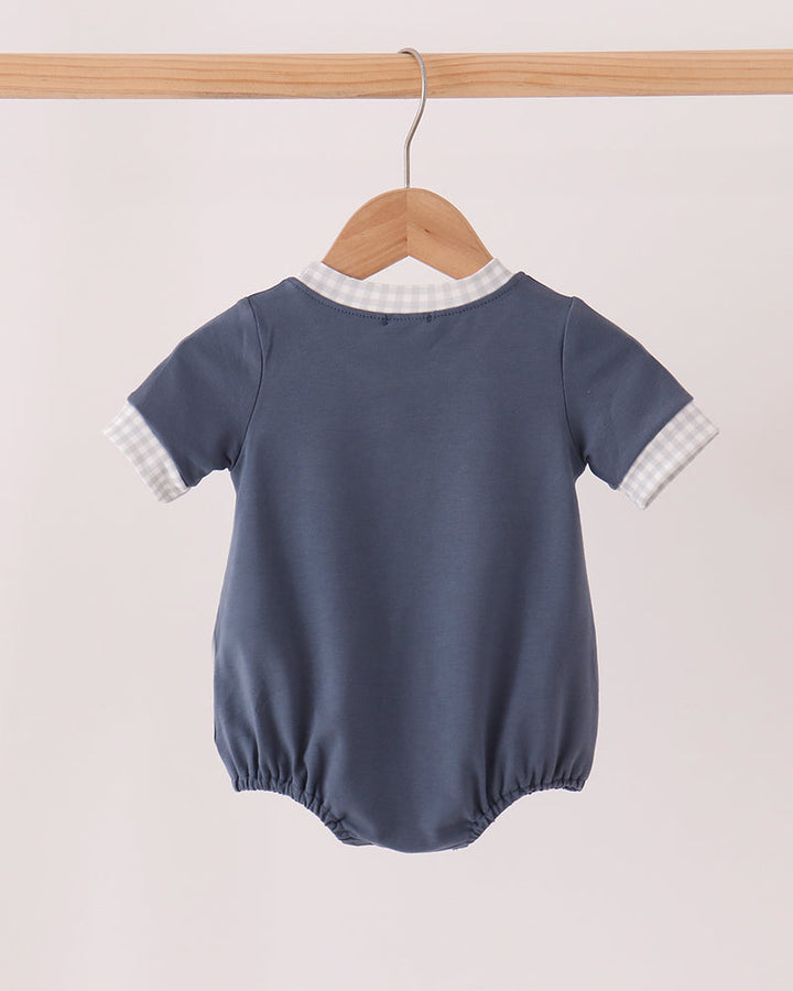 Navy short-sleeve baby romper with white gingham-trim collar and sleeves