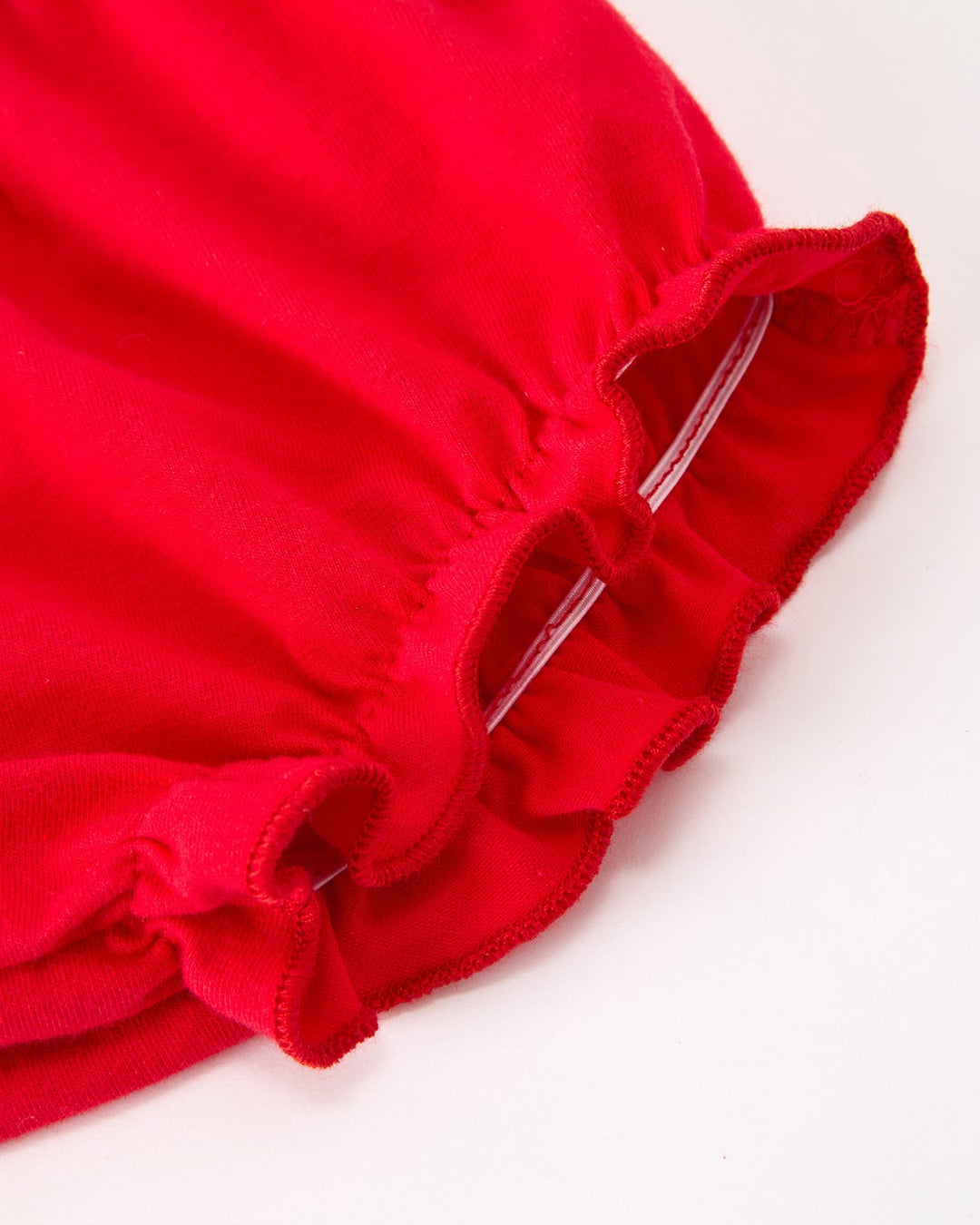 Red baby bloomer shorts with ruffled leg opening and gathered waist