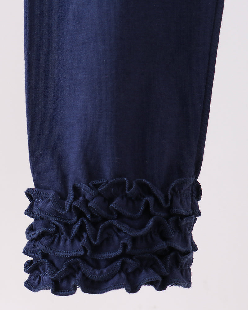 Navy leggings with layered ruffle cuffs at the ankle.