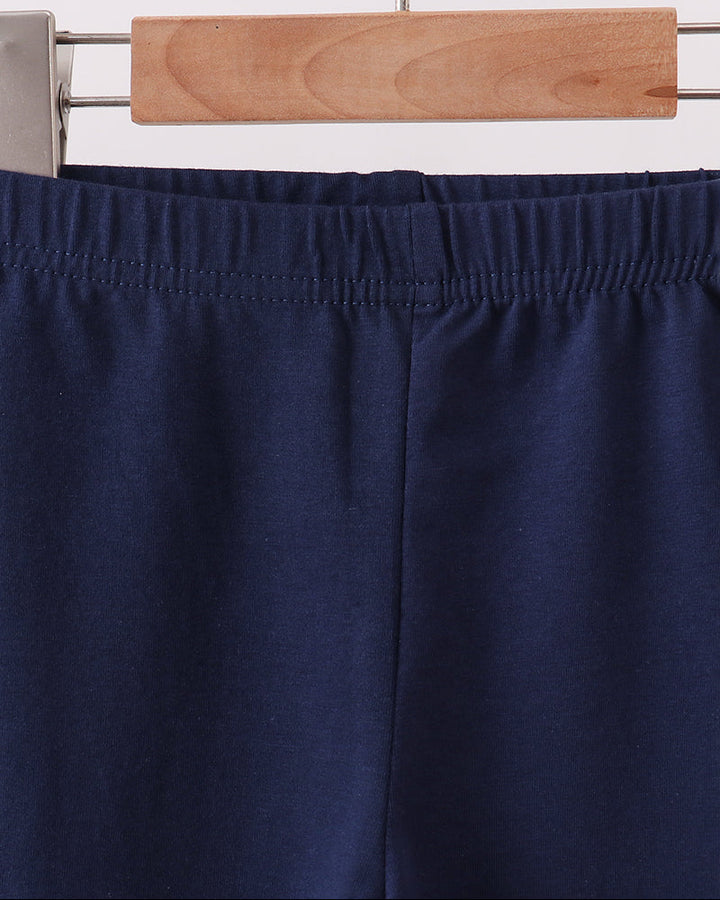 Navy leggings with elastic waistband and stitched front seam.