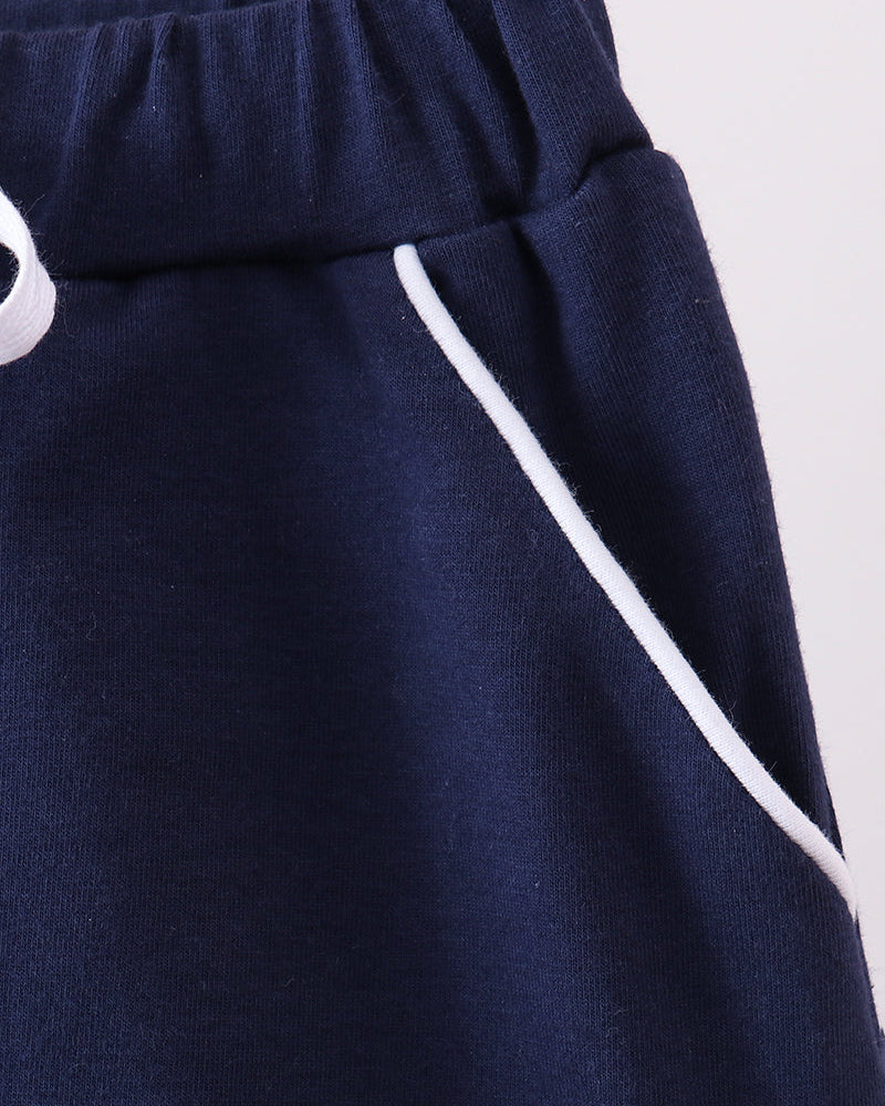 Navy skort side panel with ribbon tie end detail