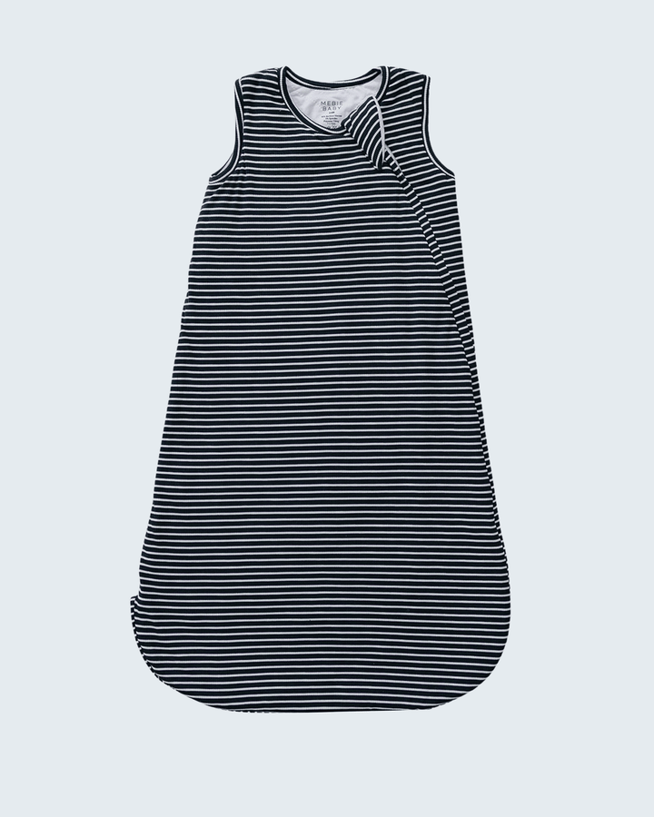 A sleeveless baby sleep sack with horizontal navy and white stripes, featuring a crossover shoulder design, shown flat against a light gray background.