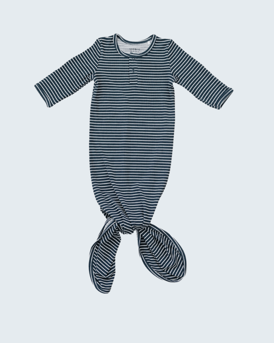 Blue and white striped baby gown on a light gray background