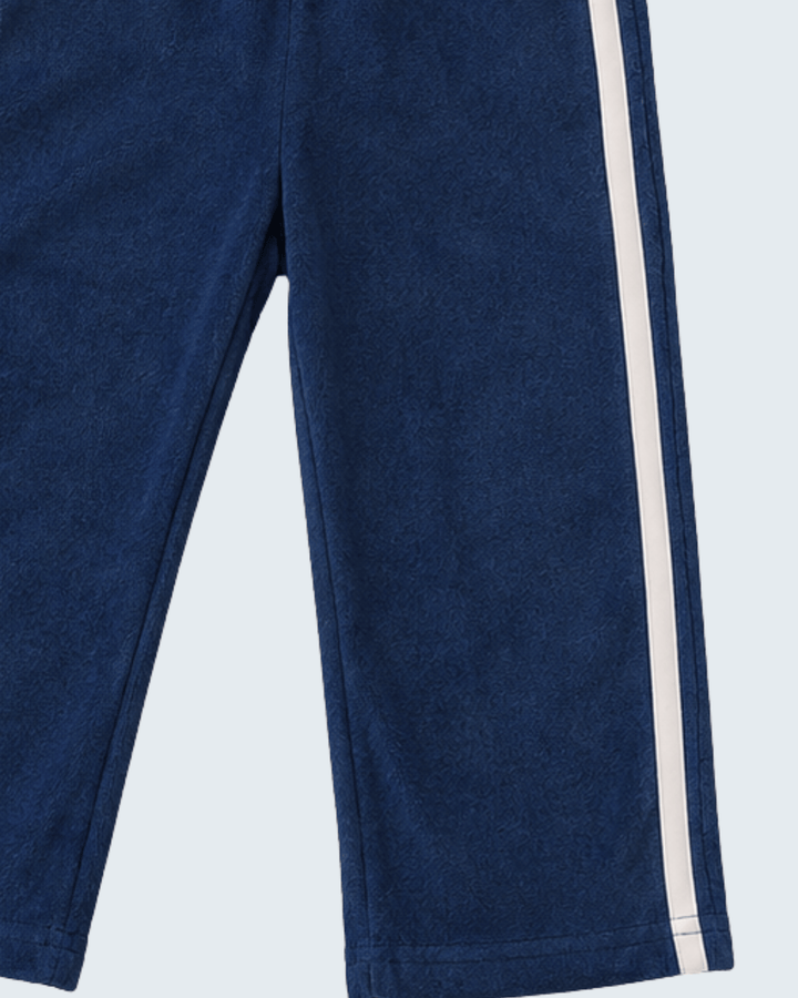 Navy terry cloth track pants with side stripe and relaxed straight leg