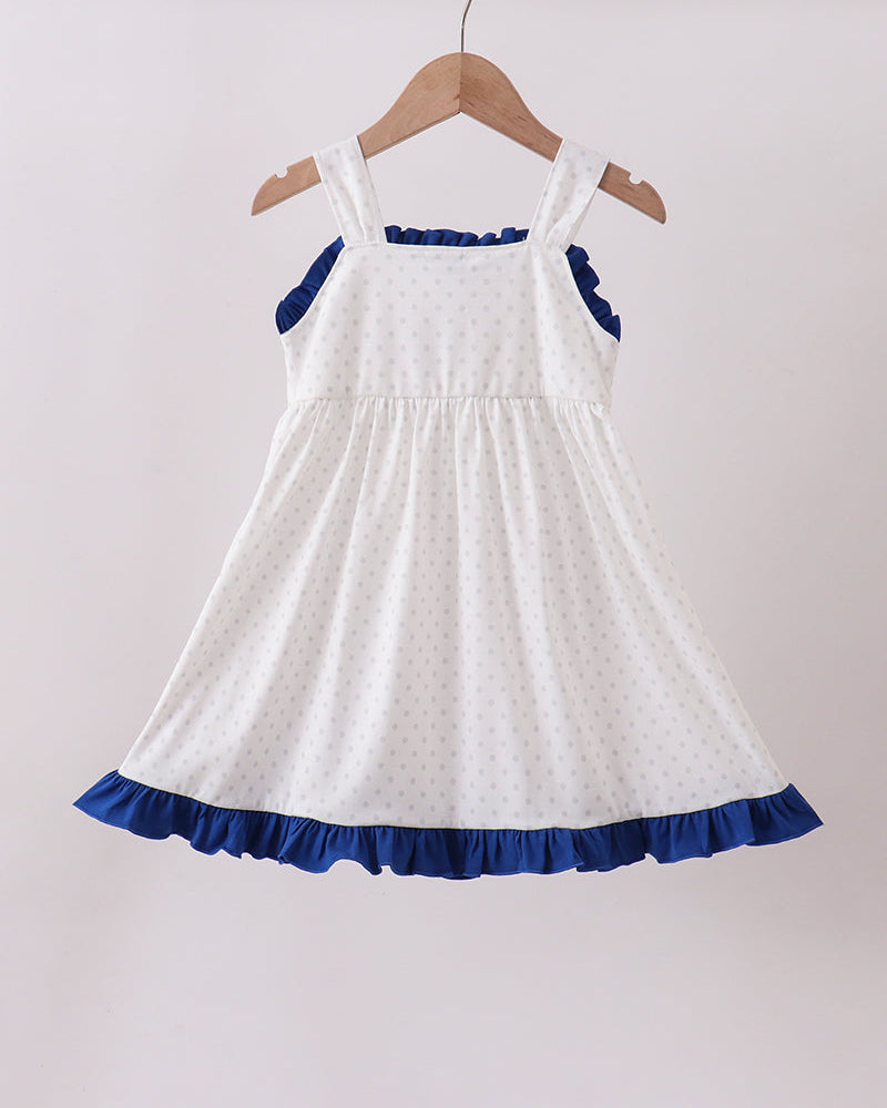 White dress with blue trim on a hanger against a white background