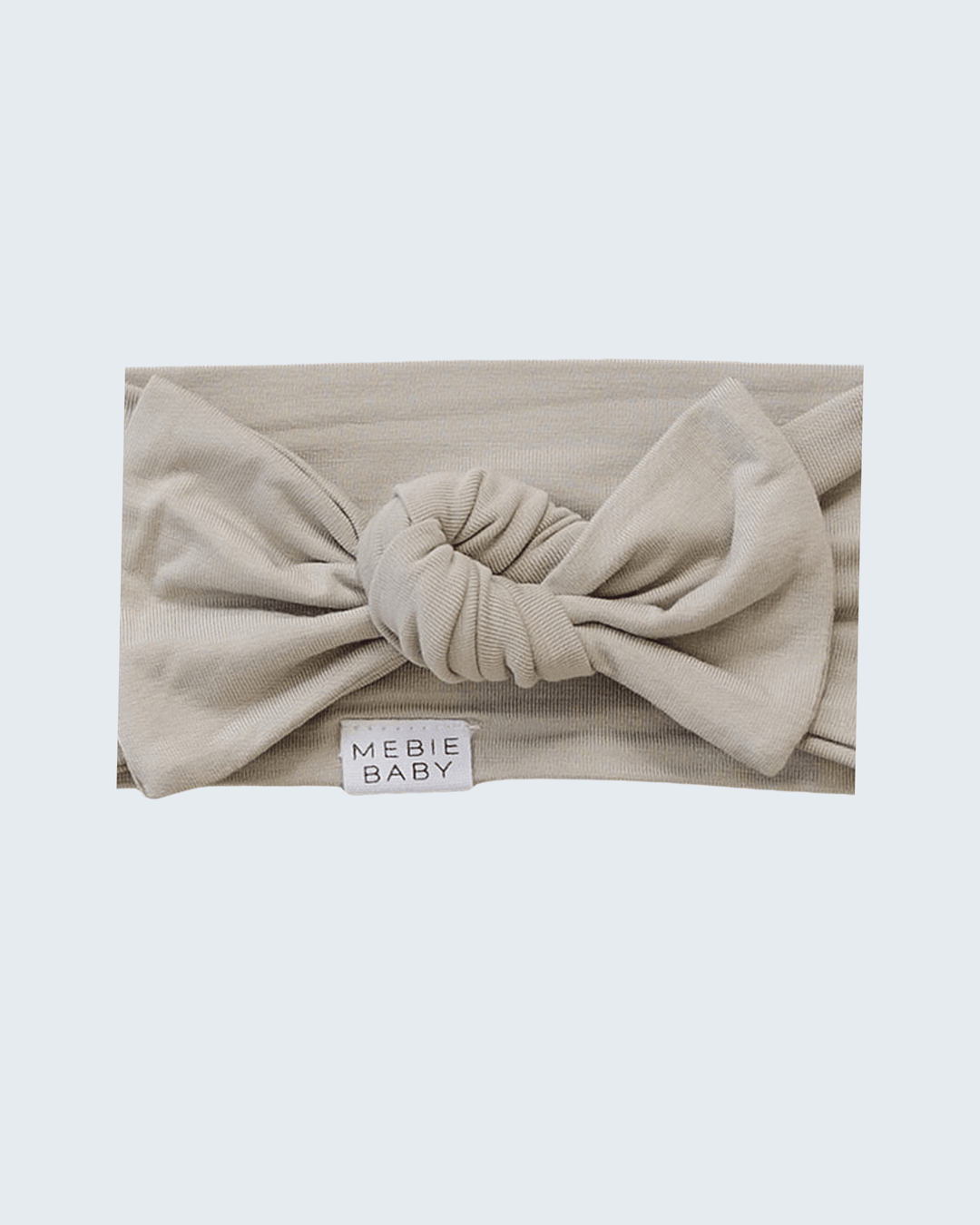 Oatmeal bamboo baby head wrap with knotted front and MEBIE BABY label