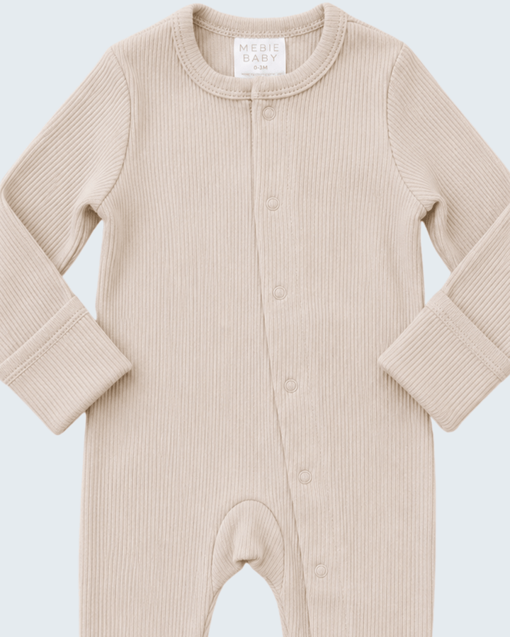 Oatmeal ribbed cotton snap romper with crew neck, snap placket, and long sleeves