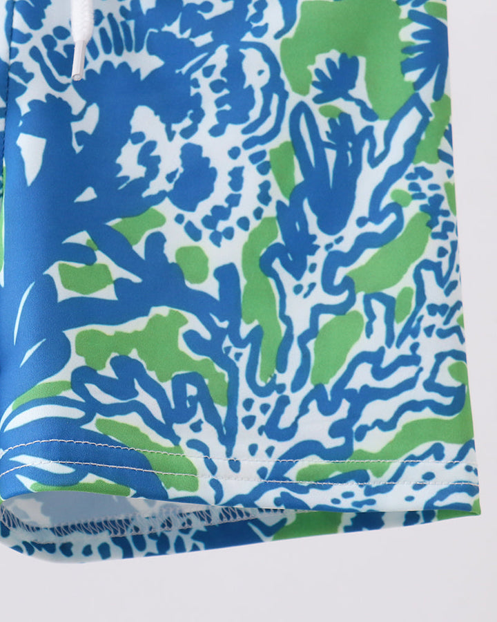 Blue and green patterned fabric on a white background
