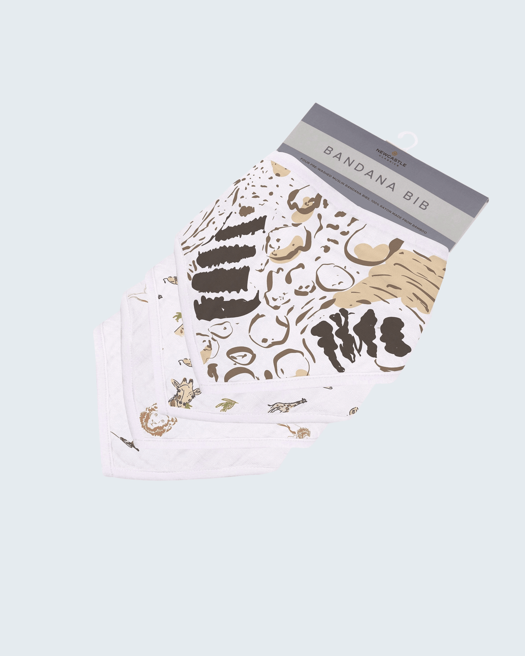 Baby bib with cake design and packaging on a light blue background