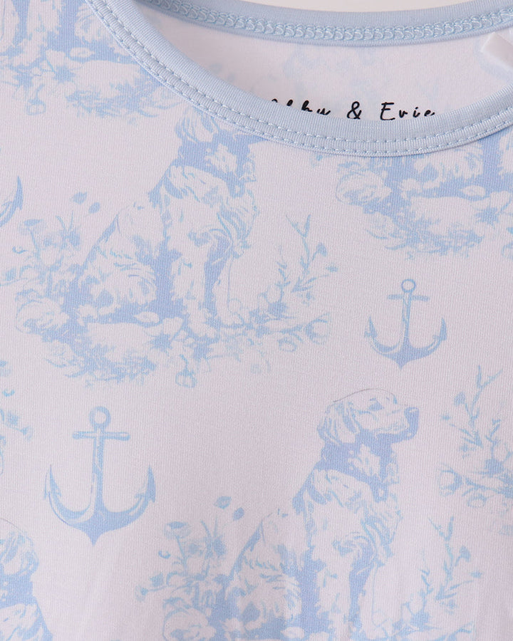 Light blue pajama top neckline with anchor and dog print, crew collar stitching
