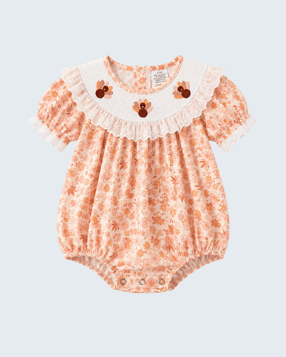 Orange floral lace bubble romper with ruffled collar and short puff sleeves