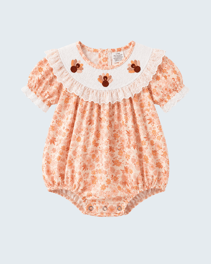 Orange floral lace bubble romper with ruffled collar and short puff sleeves