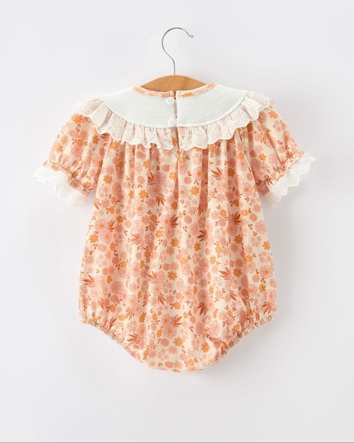 Orange floral baby romper with white lace ruffle collar and short sleeves