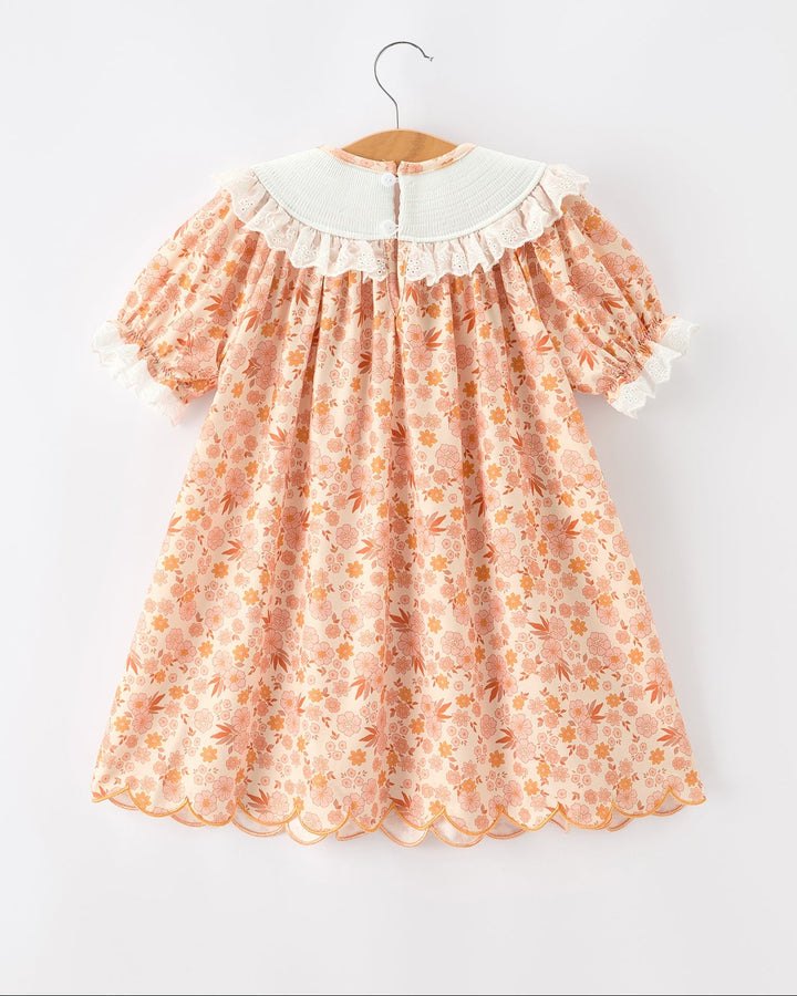 Orange floral lace dress with white ruffled collar and gathered skirt