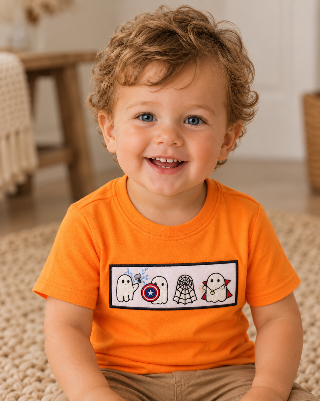 Orange short-sleeve top with embroidered character patch on chest