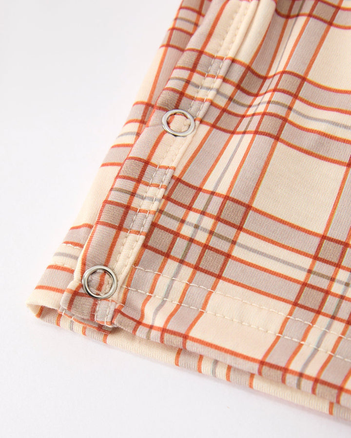 Orange plaid baby Jon Jon with adjustable strap rings and snap buttons