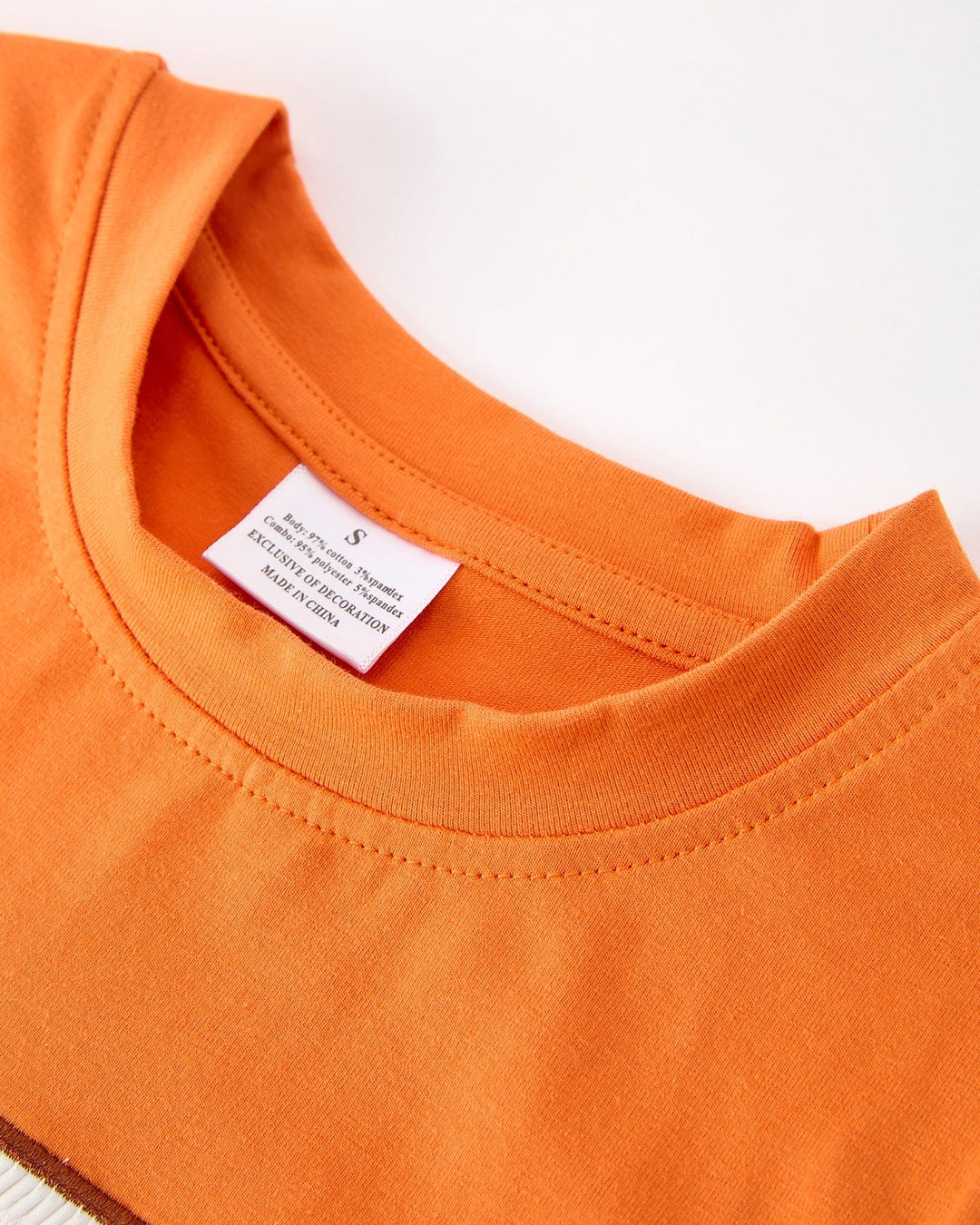 Orange kids T-shirt with crew neck and stitched hem