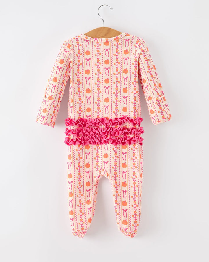 Baby sleeper in pink and cream with long sleeves and ruched waist ruffle