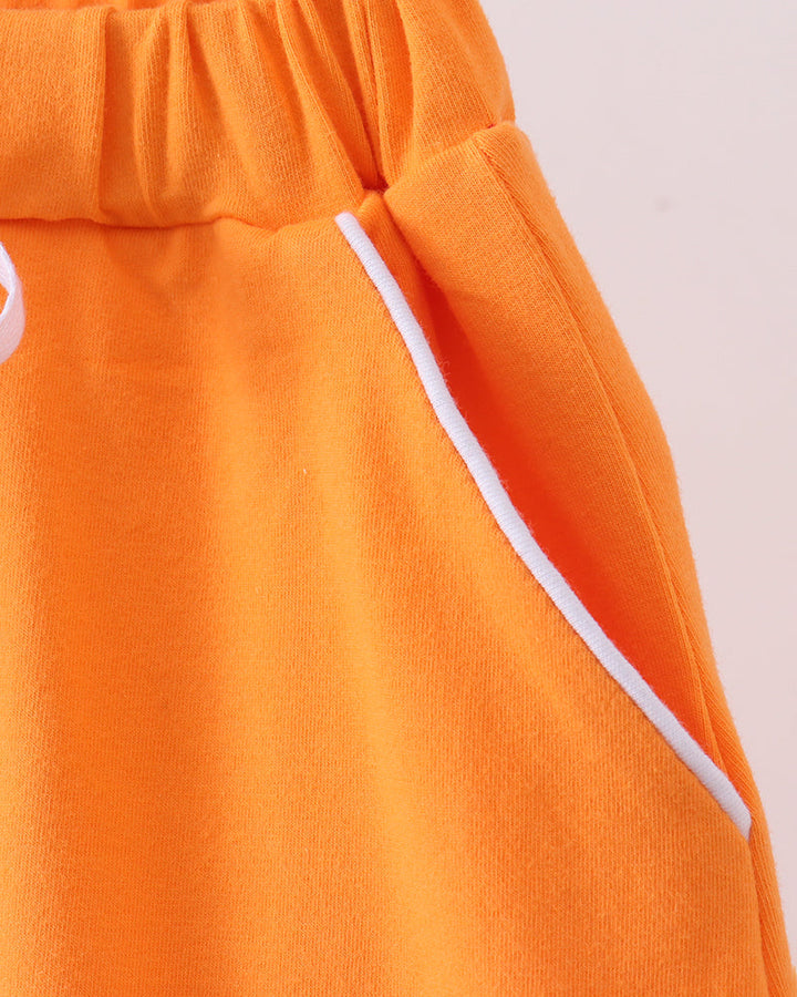 Orange skort waistband with gathered ruffle and white contrast drawstring