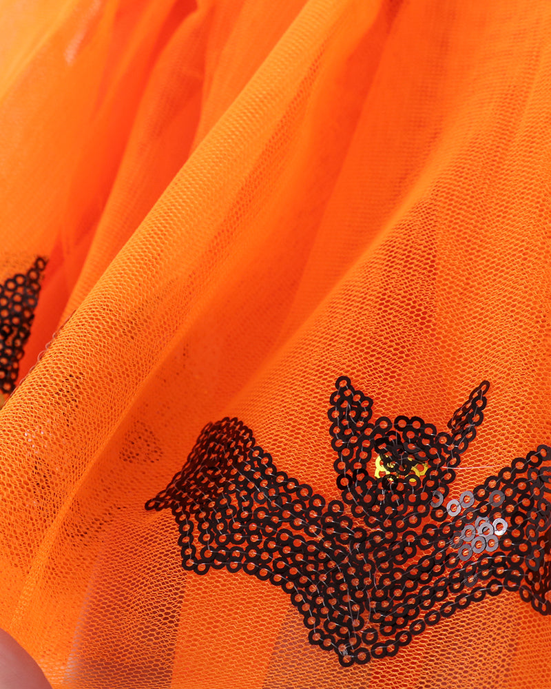 Orange tulle skirt with appliqued black and silver sequin bat design on front