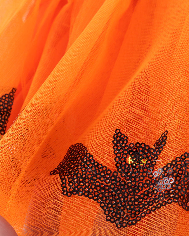 Orange tulle skirt with appliqued black and silver sequin bat design on front