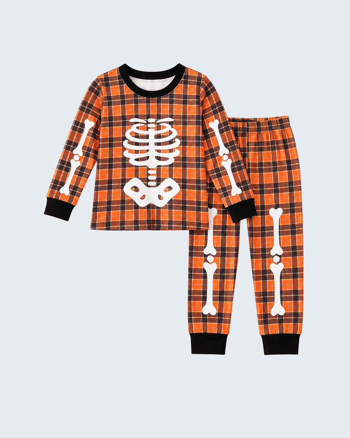 Orange plaid Halloween pants with white skeleton bone print and black cuffs