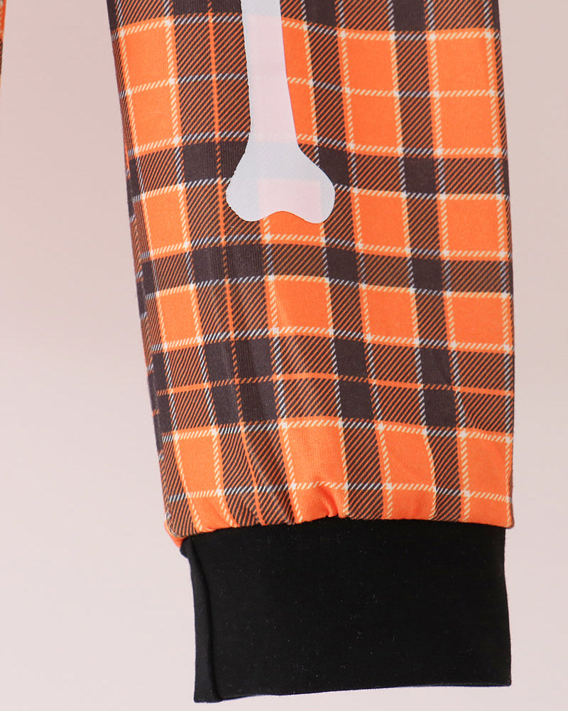 Orange plaid pant with white bone applique on front and black ankle cuff