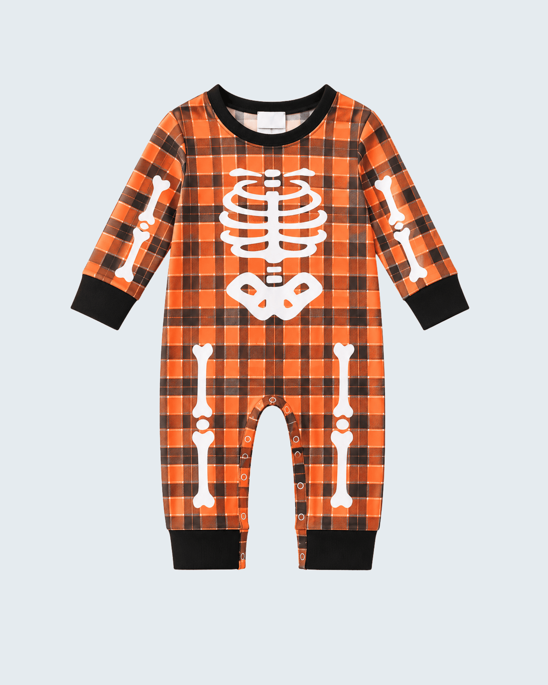 Orange plaid Halloween romper with white skeleton graphic, long sleeves, black cuffed legs