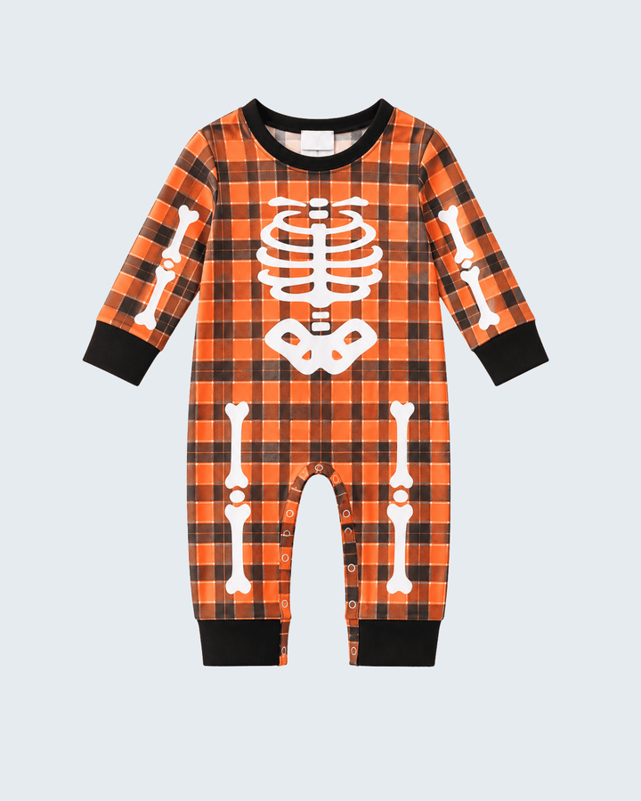 Orange plaid Halloween romper with white skeleton graphic, long sleeves, black cuffed legs