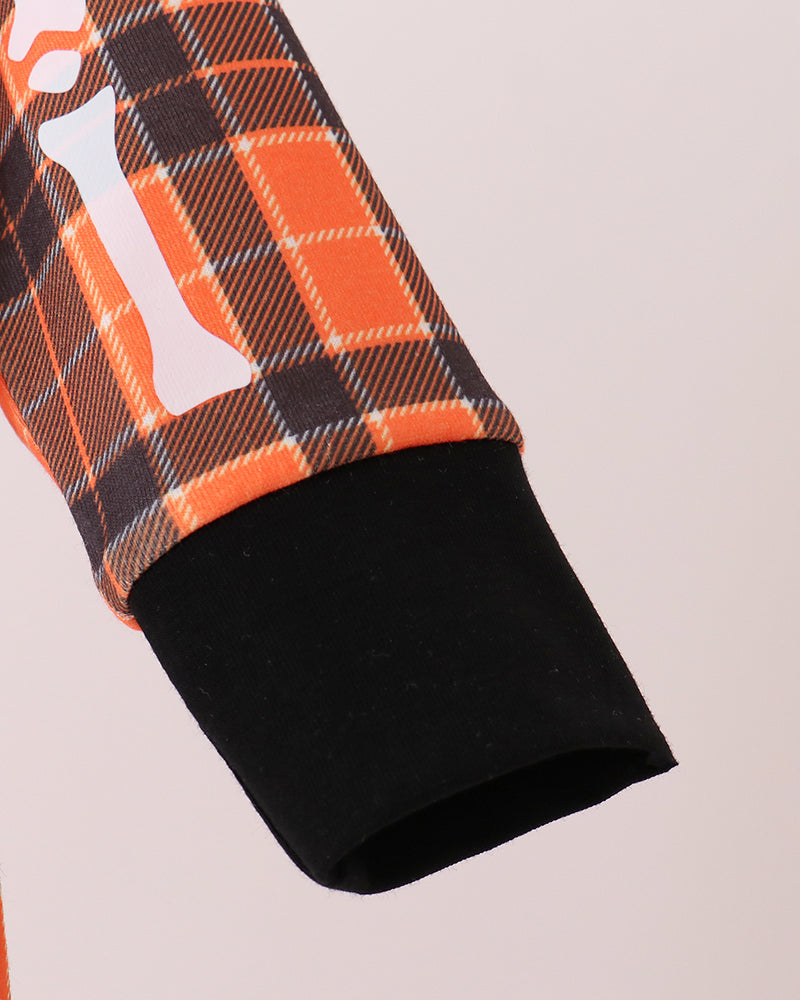Orange plaid romper sleeve end with black cuff