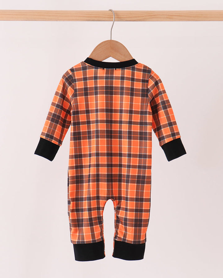 Orange plaid skeleton romper with long sleeves and black ankle cuffs