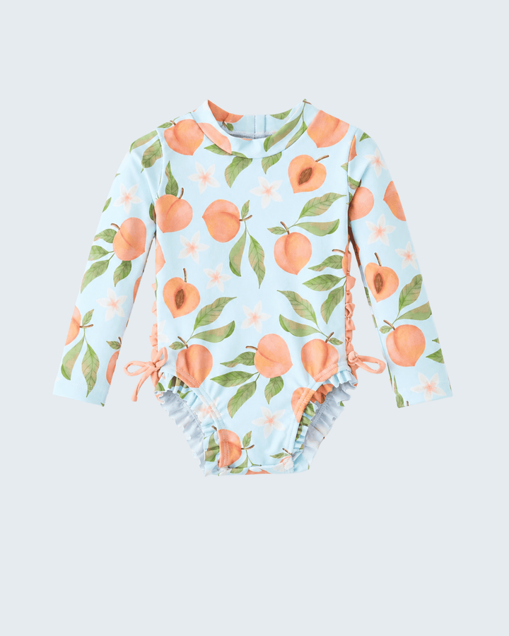 Swimsuit with peach pattern on a light blue background