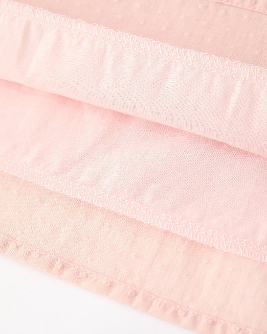 Pink ruffled skirt with gathered tiers and elastic waist seam detail