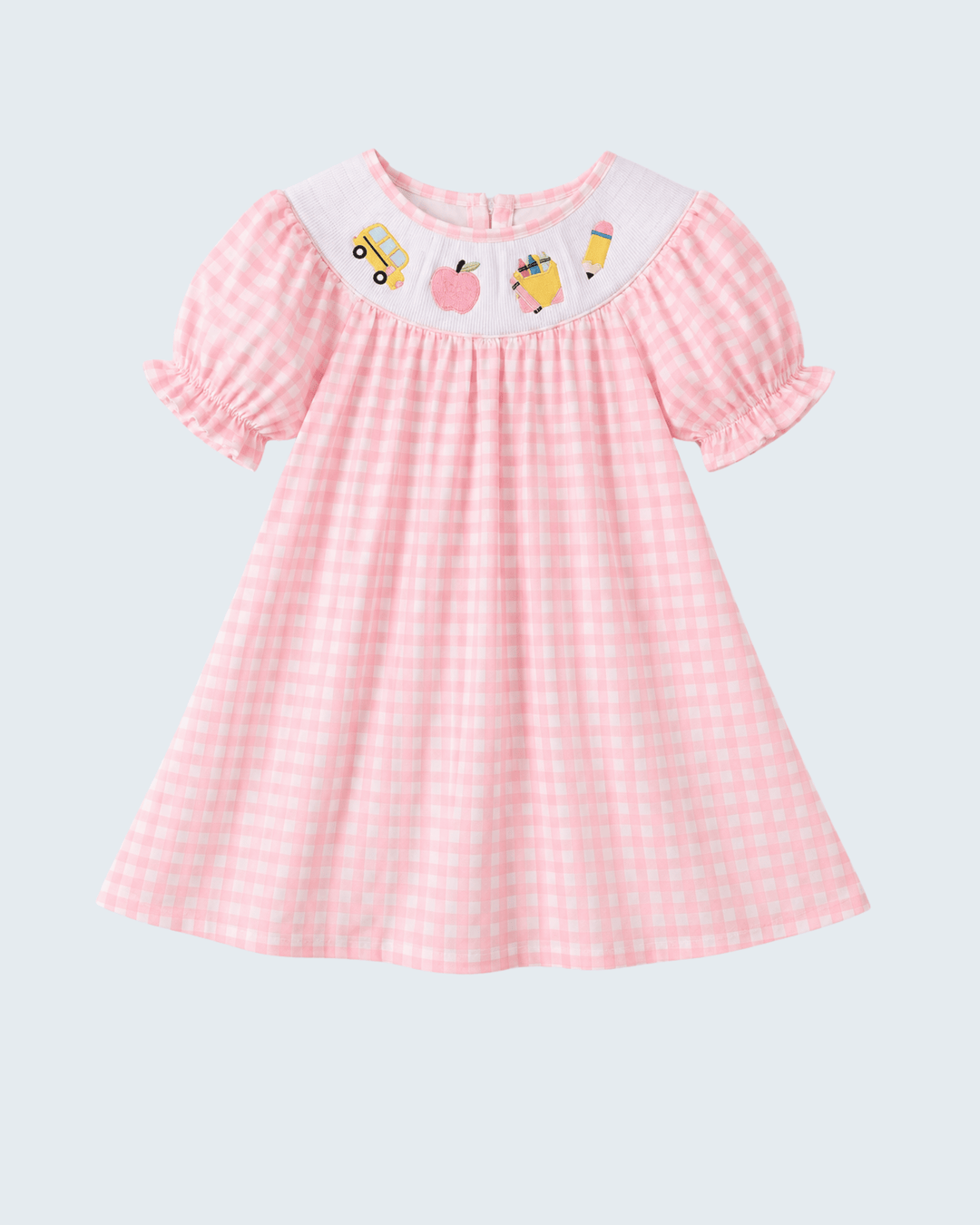 Pink gingham smocked dress with short puff sleeves and bus and apple graphic front